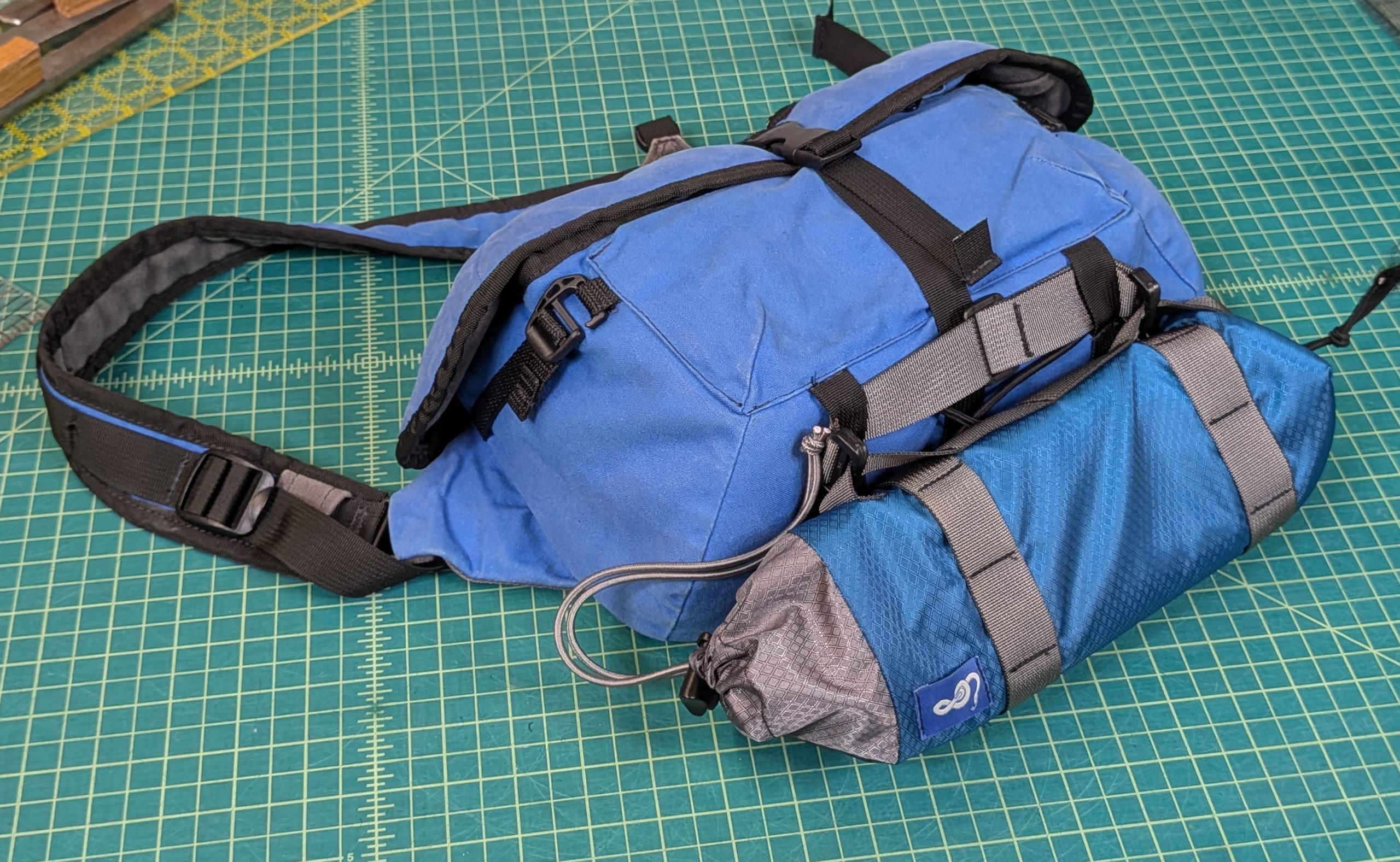 Tripod bag clipped to camera bag